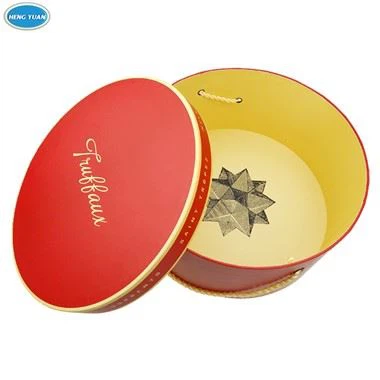 Dovanų popierinė apvali dėžutė